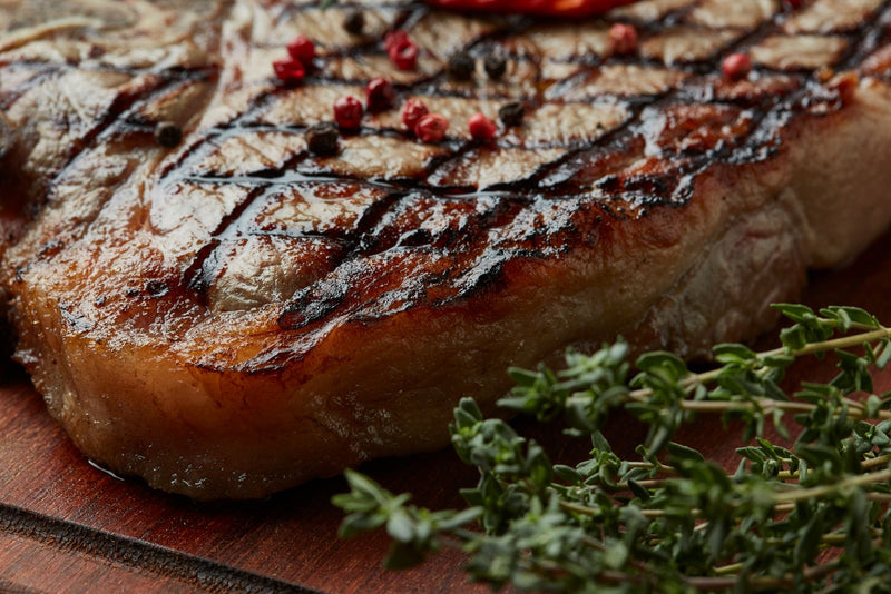 Representative real food photograph for Smoke Signals Grilled Ribeye; photo by Mohamed Olwy